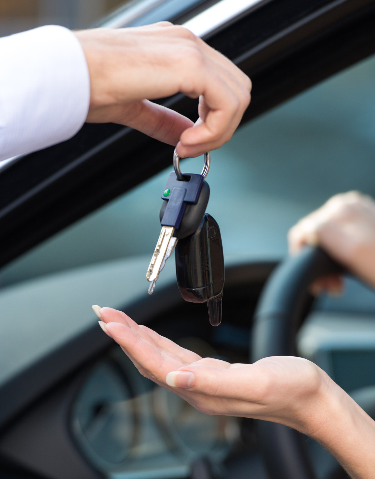 Car keys being handed over